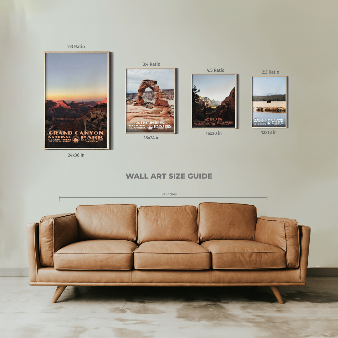 a couch sitting in front of a wall with pictures on it