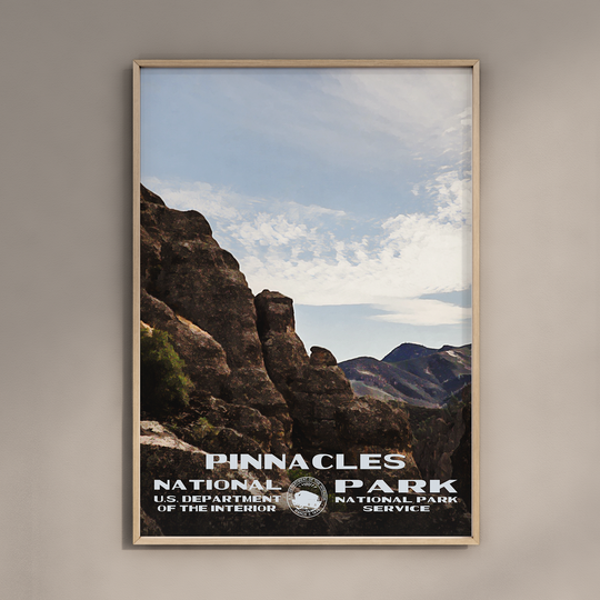 a poster of pinnacles national park hanging on a wall