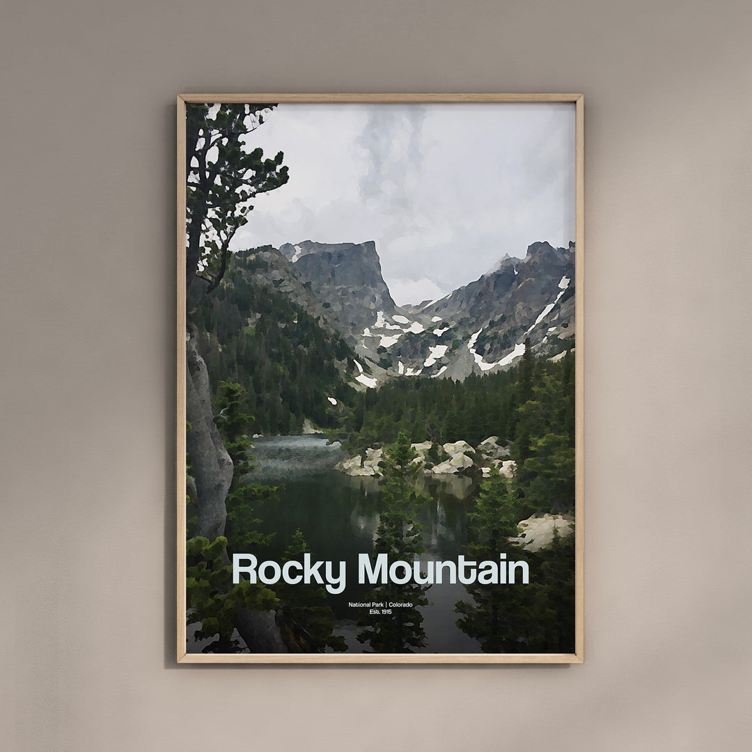 a picture of rocky mountain with a lake in the foreground