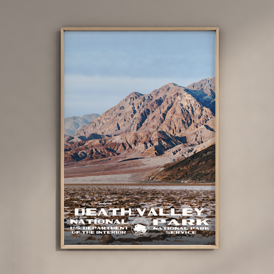 a poster of death valley national park is hanging on a wall