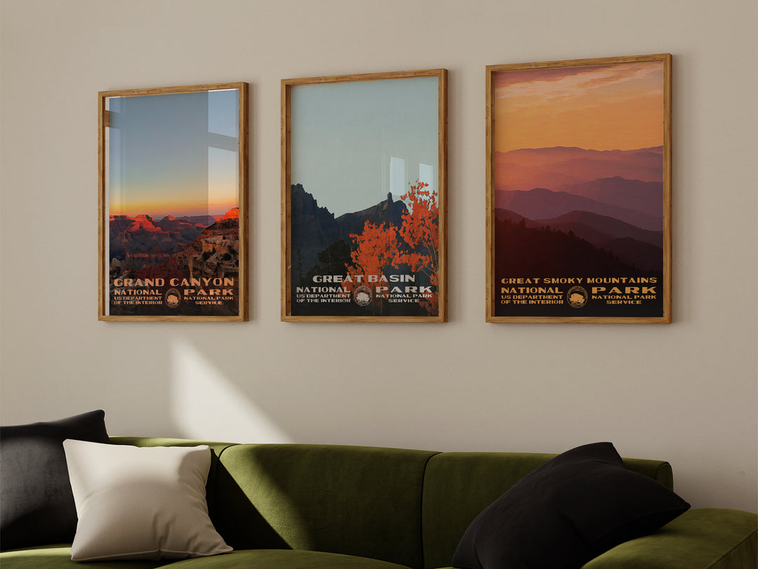 a living room with a green couch and three framed posters